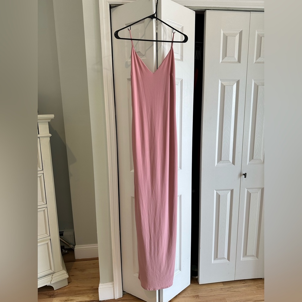 Size medium pink spaghetti strap , semi high slit in back .